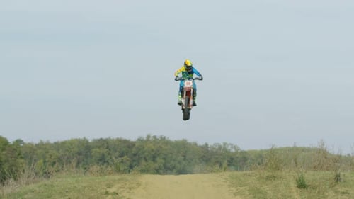 Motocross stunts on a country road