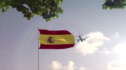 Spanish Flag Waving with Airplane Flying Over Modern City
