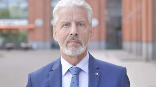Close Up of Person with White Beard in Suit