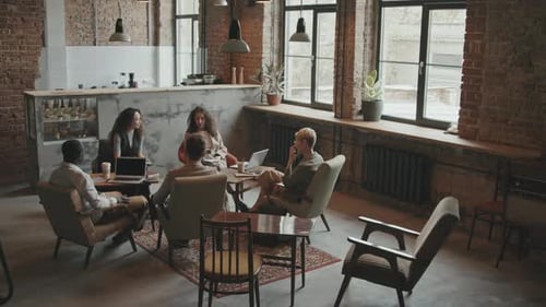 Business Team on Meeting in Modern Coworking Loft Office