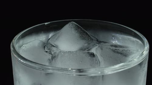 Glass of ice cubes close up shot