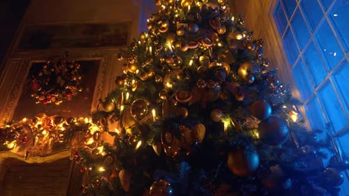Elegant Christmas Tree Glowing with Golden Ornaments
