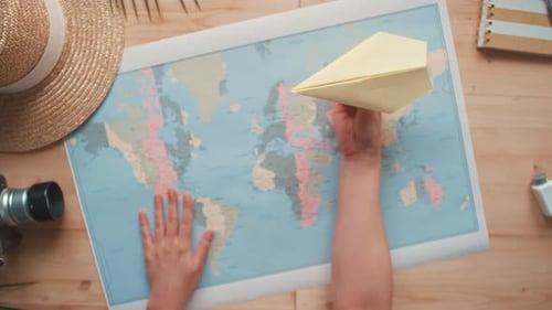 Paper Airplane Above World Map for Travel Concept