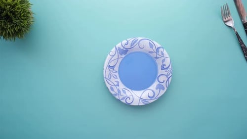 Putting Empty Plate on Table Top View
