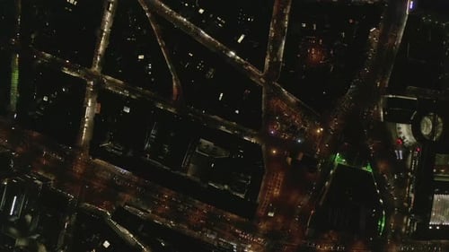 AERIAL: Slow Overhead Shot of City at Night with Lights and Traffic, Cologne, Germany