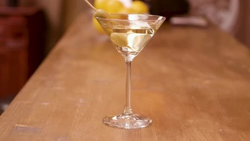 Parallax Shot of a Martini Glass on a Bar Counter
