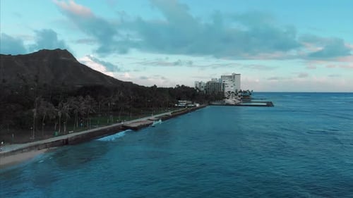 Aerial drone footage of Honolulu, Hawaii.
Beautiful real estate, buildings in the city.
Palm trees