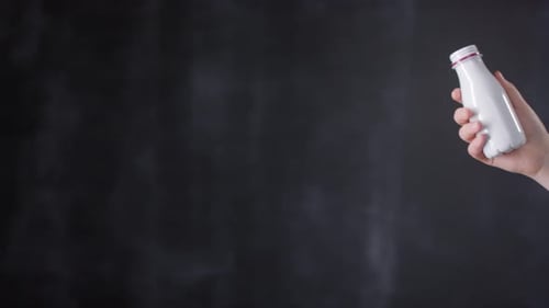 Woman Crushes a Bottle in Her Hand