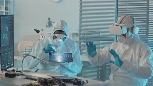 Engineers in Coveralls Doing Research on Computer Components in Lab