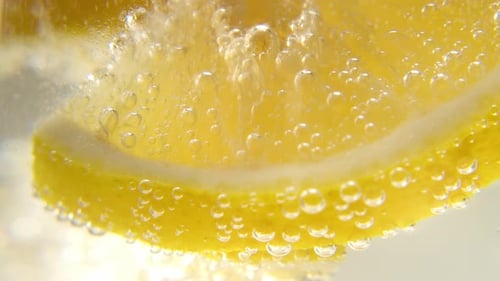 Lemon Slices Refreshing in Bubbly Water Close-Up