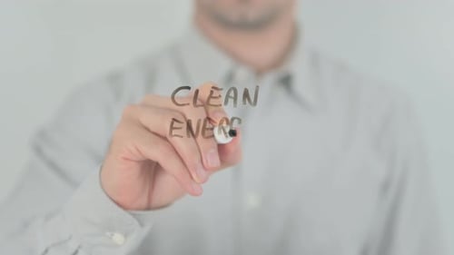 Man Writes Clean Energy Concept with Marker
