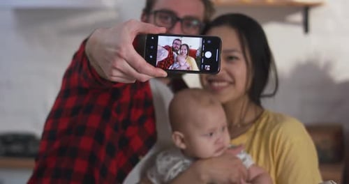 Young Family Takes a Selfie at Home