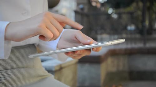 Close Handed Business Woman and Tablet on the Street in the Business District