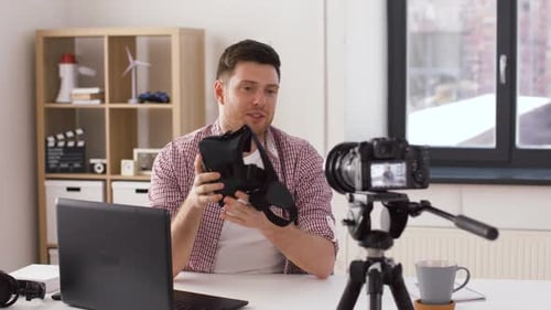 Man Reviewing VR Headset with Camera