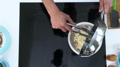 Chef Prepares Delicious Pasta with Cheese