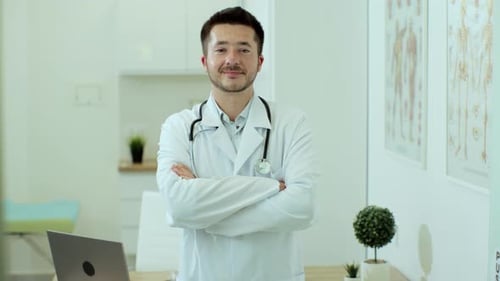 Smiling Young Adult Doctor in Modern Office