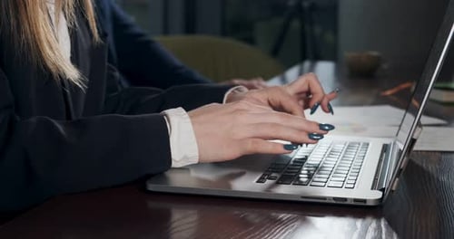 Female Hands Typing Laptop Keyboard and Touching Touchpad. Woman Working with Notebook. Hands Close