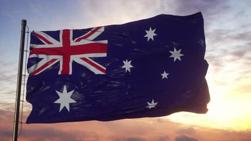 Waving Australian Flag Against a Cloudy Sunset Sky