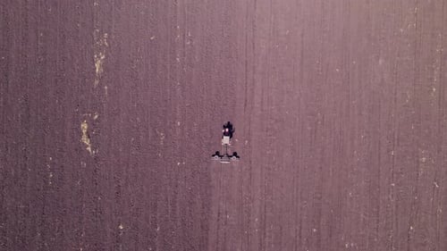 Aerial View of the Tractor Plow a Ground