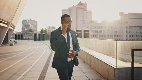 Confident Professional on Phone in City at Sunset