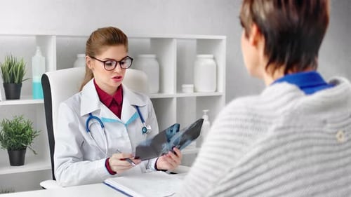 Woman Doctor Consults with Patient