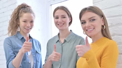 Ambitious Creative Startup Team Showing Thumbs Up in Office
