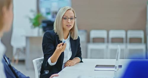 Woman Giving Business Presentation in Office Meeting