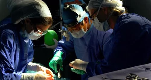 Surgeons performing operation at hospital 4k