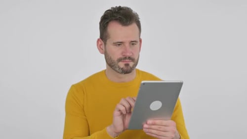 Portrait of Middle Aged Man Celebrating on Tablet in Office