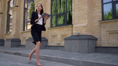 Businesswoman Walking To Work