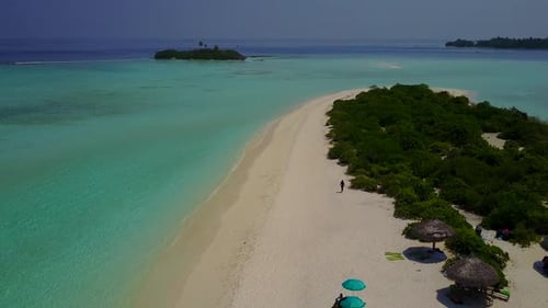 Aerial drone panorama of coast beach break by blue lagoon with sand background