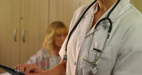 Female doctor using a digital tablet