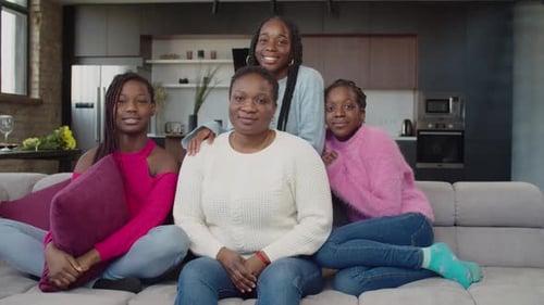 Portrait of United African American Family Smiling on Couch