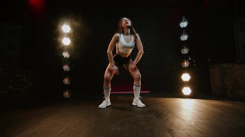 Pretty Brunette Dancing Twerk In Studio With Flashing Light