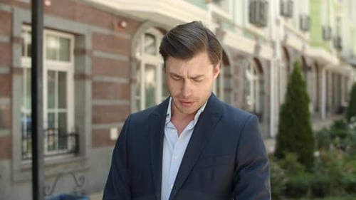 Closeup Man Waiting for Partner at Street. Man Checking Time on Smart Watch