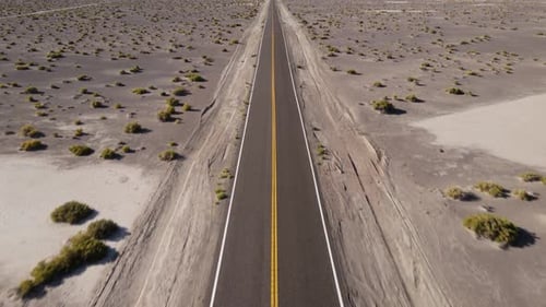 Aerial shot of a remote desert road with no cars in Nevada