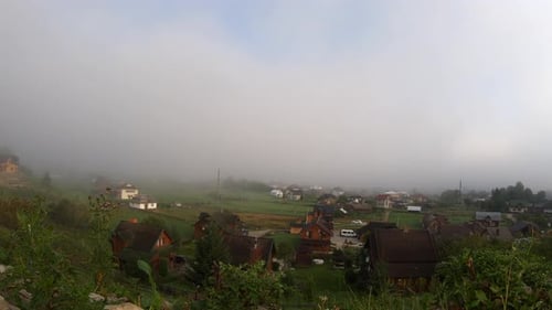 Foggy Morning in a Serene Rural Village