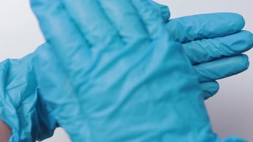 Medical Gloves Holding Red Heart