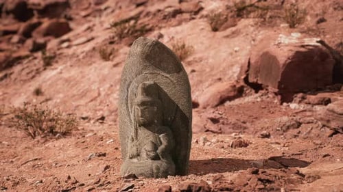 Ancient Statue on the Rocks Desert