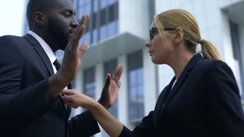 Business People Arguing Outside Office Building