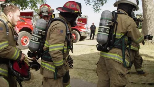 Firefighters Ready at the Scene in the Daytime