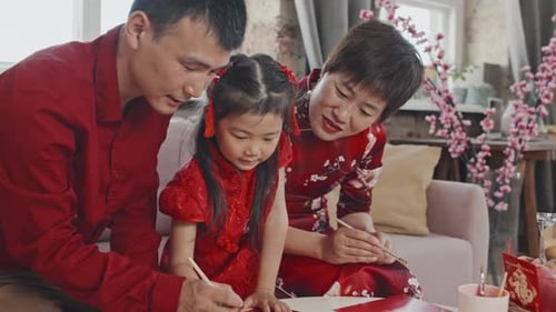 Chinese Family of Three Making Lunar New Year Postcard