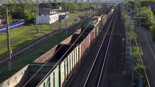 Freight Train Carries Cargo. View of the Train From Above. Rail Transport for Intercity Trade.