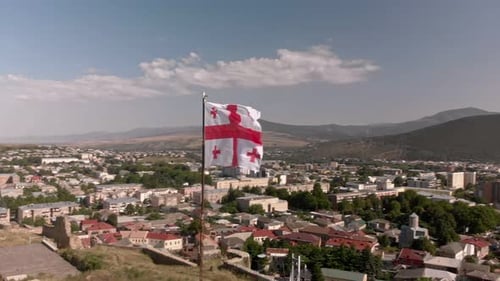 Flag Waving over City Aerial View