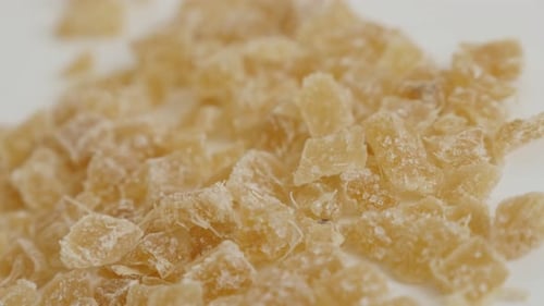 Close-up of cooked and candied ginger root on the table slow pan 4K 2160p 30fps UltraHD footage -