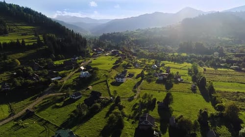 Sunset Drone Landscape, Aerial View of the Village, Mountain And Forest with Blue Sky