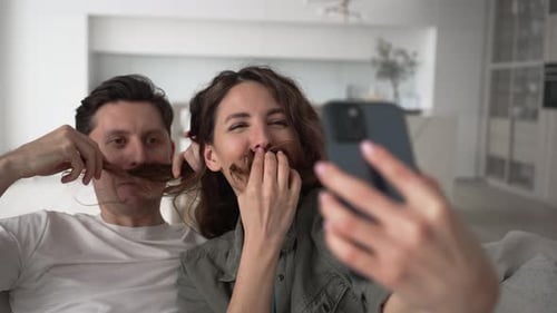 Couple Takes Silly Selfies With Hair Mustaches