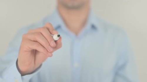 Hand Writing Goals With Marker on Clear Surface