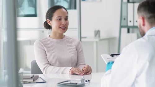 Young Positive Woman Visiting Doctor in Medical Office