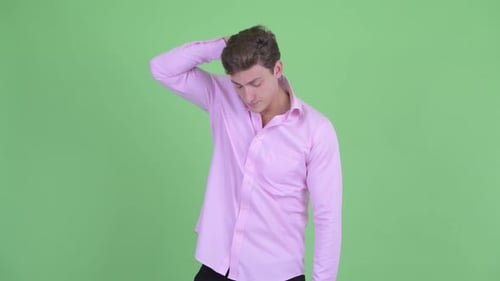 Young Adult Adjusting Hair in Studio